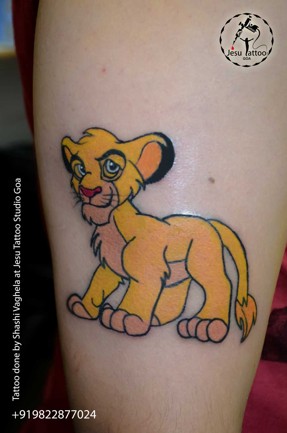 Lion King tattoo located on the bicep.